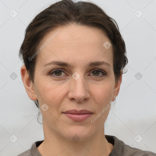 Joyful white adult female with short  brown hair and grey eyes