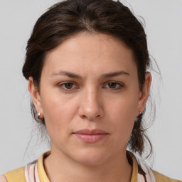 Neutral white young-adult female with medium  brown hair and brown eyes