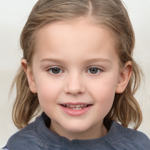 Joyful white child female with medium  brown hair and grey eyes