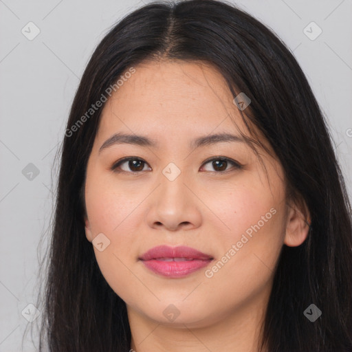 Joyful asian young-adult female with long  brown hair and brown eyes