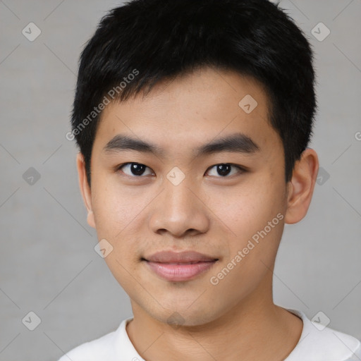 Joyful asian young-adult male with short  black hair and brown eyes