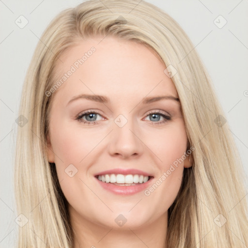 Joyful white young-adult female with long  brown hair and blue eyes