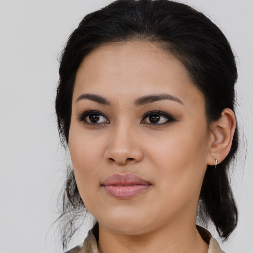 Joyful asian young-adult female with long  brown hair and brown eyes
