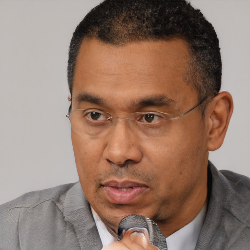 Neutral black adult male with short  black hair and brown eyes