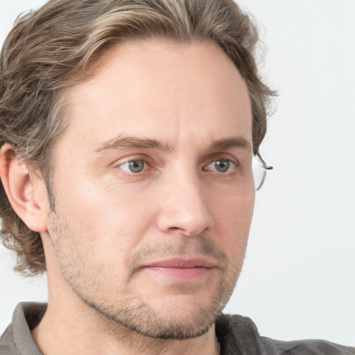 Joyful white adult male with short  brown hair and grey eyes