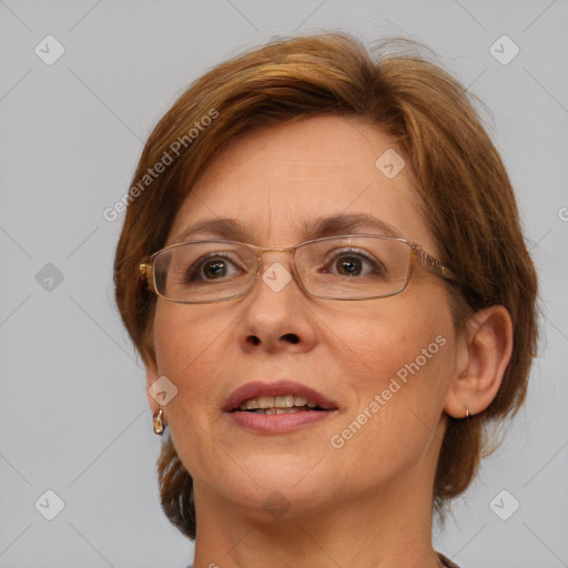 Joyful white adult female with medium  brown hair and blue eyes