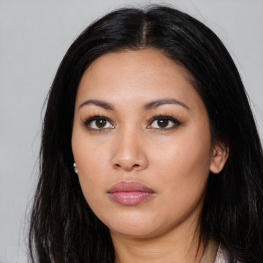 Neutral latino young-adult female with long  black hair and brown eyes