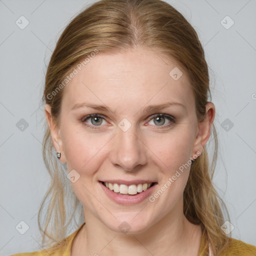 Joyful white young-adult female with medium  brown hair and blue eyes