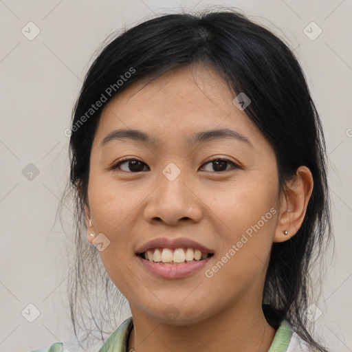 Joyful asian young-adult female with medium  black hair and brown eyes