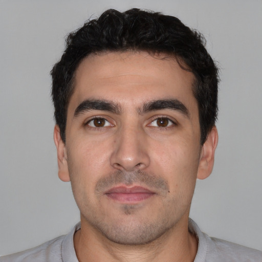 Neutral white young-adult male with short  black hair and brown eyes