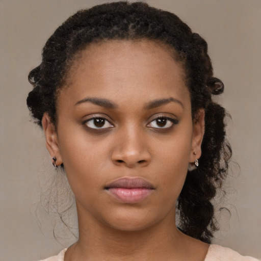 Neutral black young-adult female with short  brown hair and brown eyes