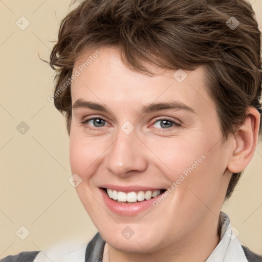 Joyful white young-adult female with short  brown hair and brown eyes