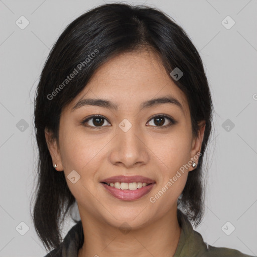 Joyful latino young-adult female with medium  brown hair and brown eyes