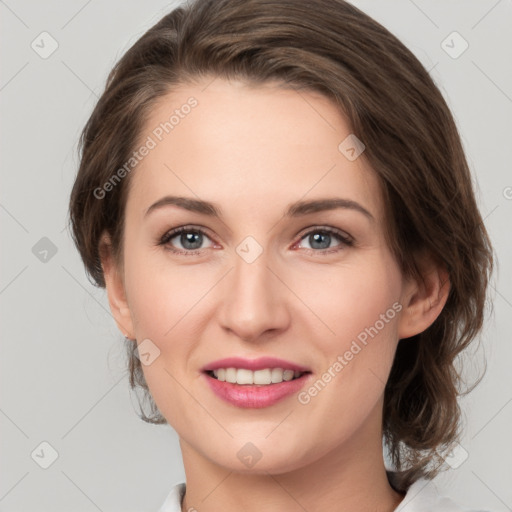 Joyful white young-adult female with medium  brown hair and green eyes