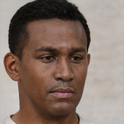 Neutral latino young-adult male with short  brown hair and brown eyes