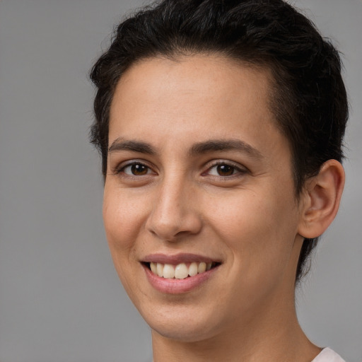 Joyful white young-adult female with short  brown hair and brown eyes