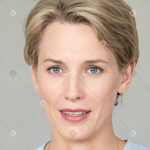 Joyful white adult female with medium  brown hair and blue eyes