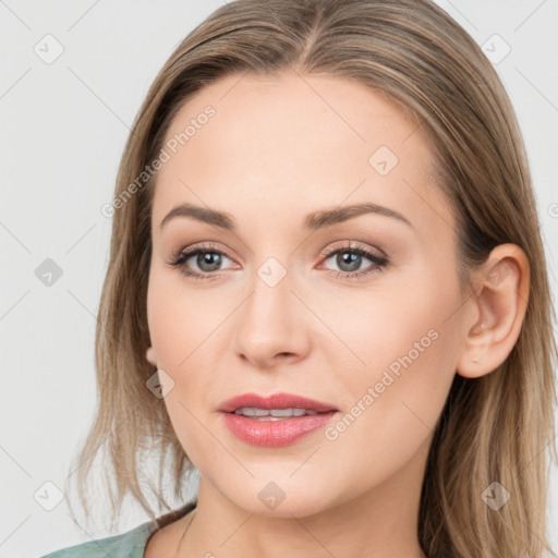 Joyful white young-adult female with long  brown hair and blue eyes