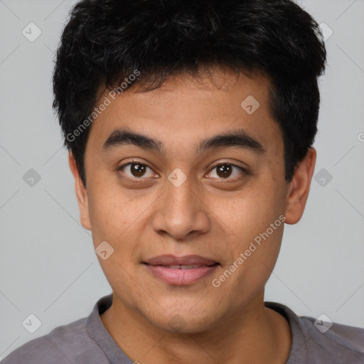 Joyful asian young-adult male with short  black hair and brown eyes