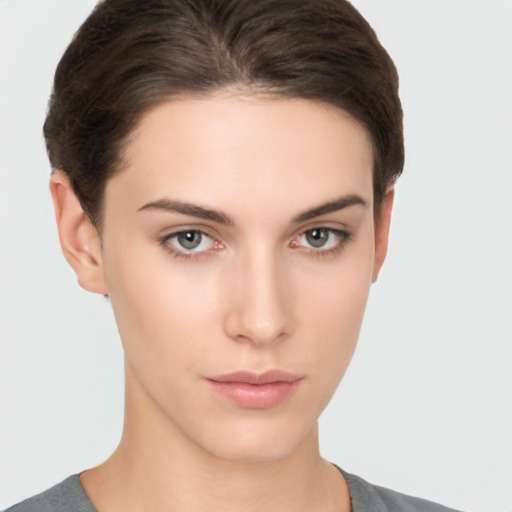 Neutral white young-adult female with short  brown hair and brown eyes