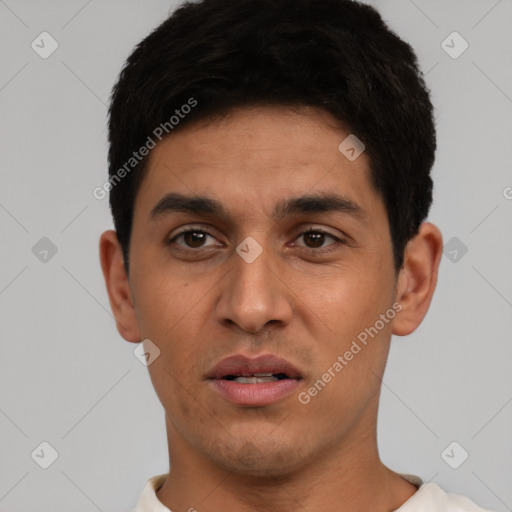 Neutral latino young-adult male with short  black hair and brown eyes