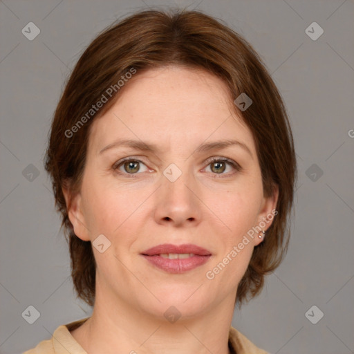 Joyful white adult female with medium  brown hair and grey eyes