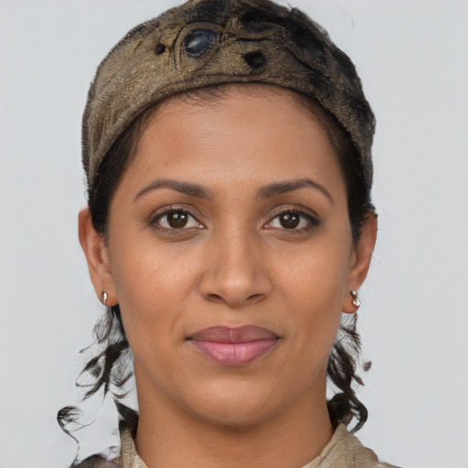 Joyful latino young-adult female with short  brown hair and brown eyes