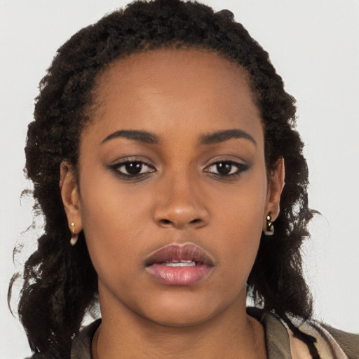 Neutral black young-adult female with long  brown hair and brown eyes