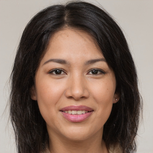 Joyful white young-adult female with long  brown hair and brown eyes