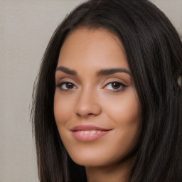 Joyful white young-adult female with long  black hair and brown eyes