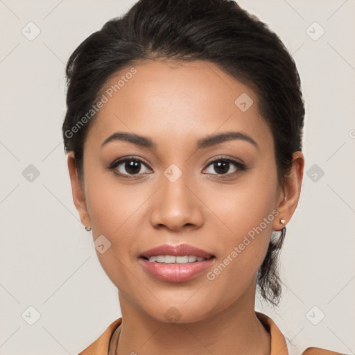 Joyful latino young-adult female with long  brown hair and brown eyes