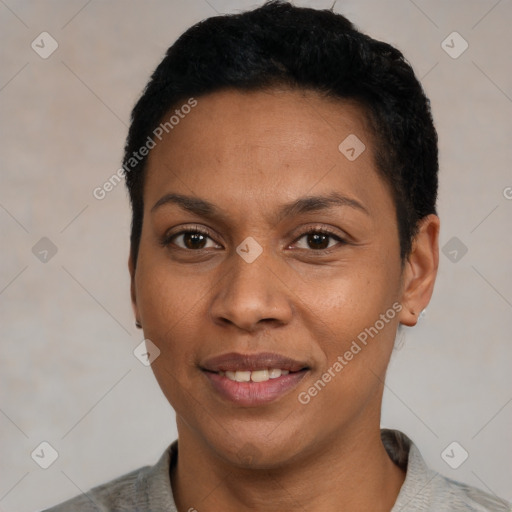 Joyful black young-adult female with short  black hair and brown eyes