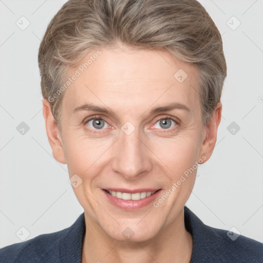 Joyful white adult female with short  brown hair and grey eyes