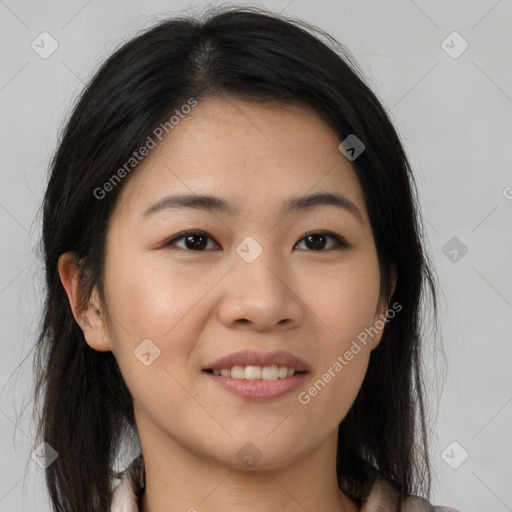 Joyful asian young-adult female with long  brown hair and brown eyes