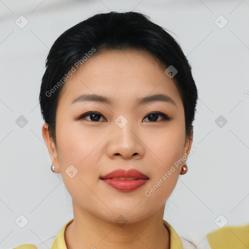 Joyful asian young-adult female with short  brown hair and brown eyes