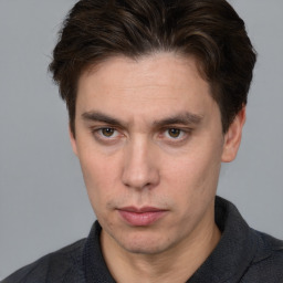 Neutral white adult male with short  brown hair and brown eyes