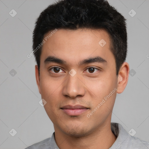 Joyful white young-adult male with short  black hair and brown eyes