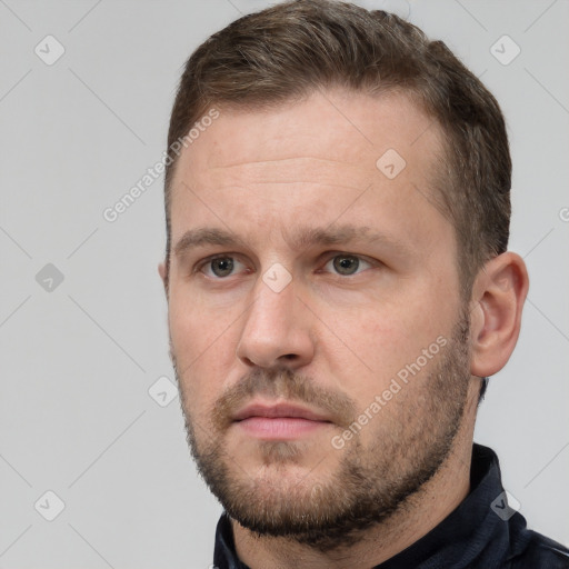 Neutral white young-adult male with short  brown hair and brown eyes