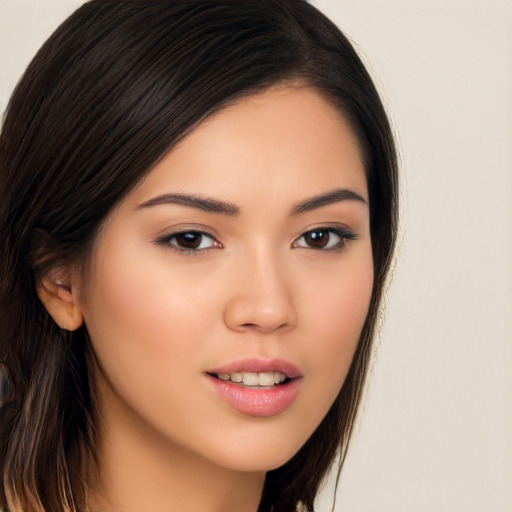 Joyful asian young-adult female with long  brown hair and brown eyes