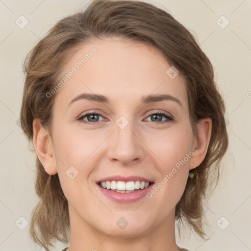 Joyful white young-adult female with medium  brown hair and green eyes