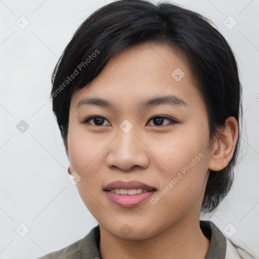 Joyful asian young-adult female with medium  black hair and brown eyes