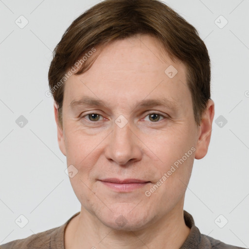 Joyful white adult male with short  brown hair and grey eyes