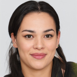 Joyful latino young-adult female with long  brown hair and brown eyes