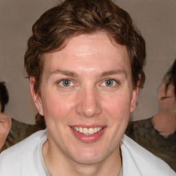 Joyful white adult female with medium  brown hair and blue eyes