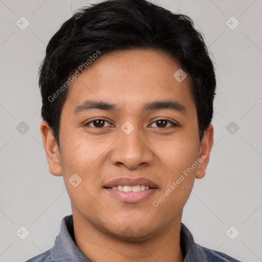 Joyful latino young-adult male with short  black hair and brown eyes