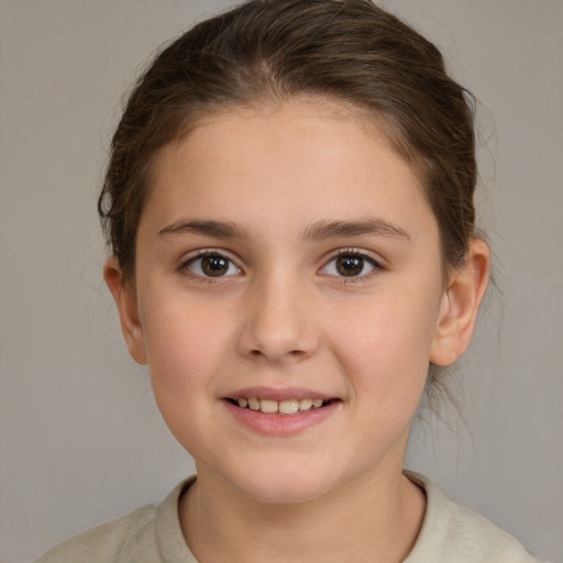 Joyful white child female with medium  brown hair and brown eyes