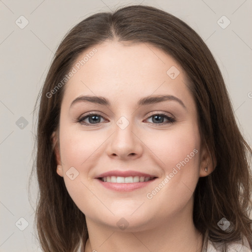 Joyful white young-adult female with long  brown hair and grey eyes