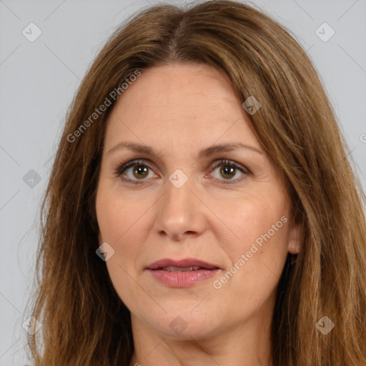 Joyful white adult female with long  brown hair and brown eyes