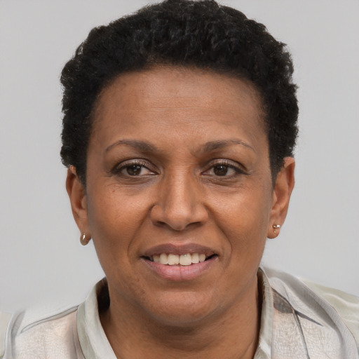 Joyful latino adult female with short  brown hair and brown eyes