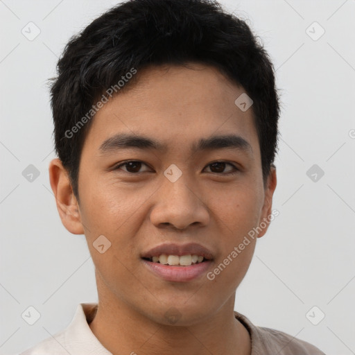 Joyful asian young-adult male with short  brown hair and brown eyes